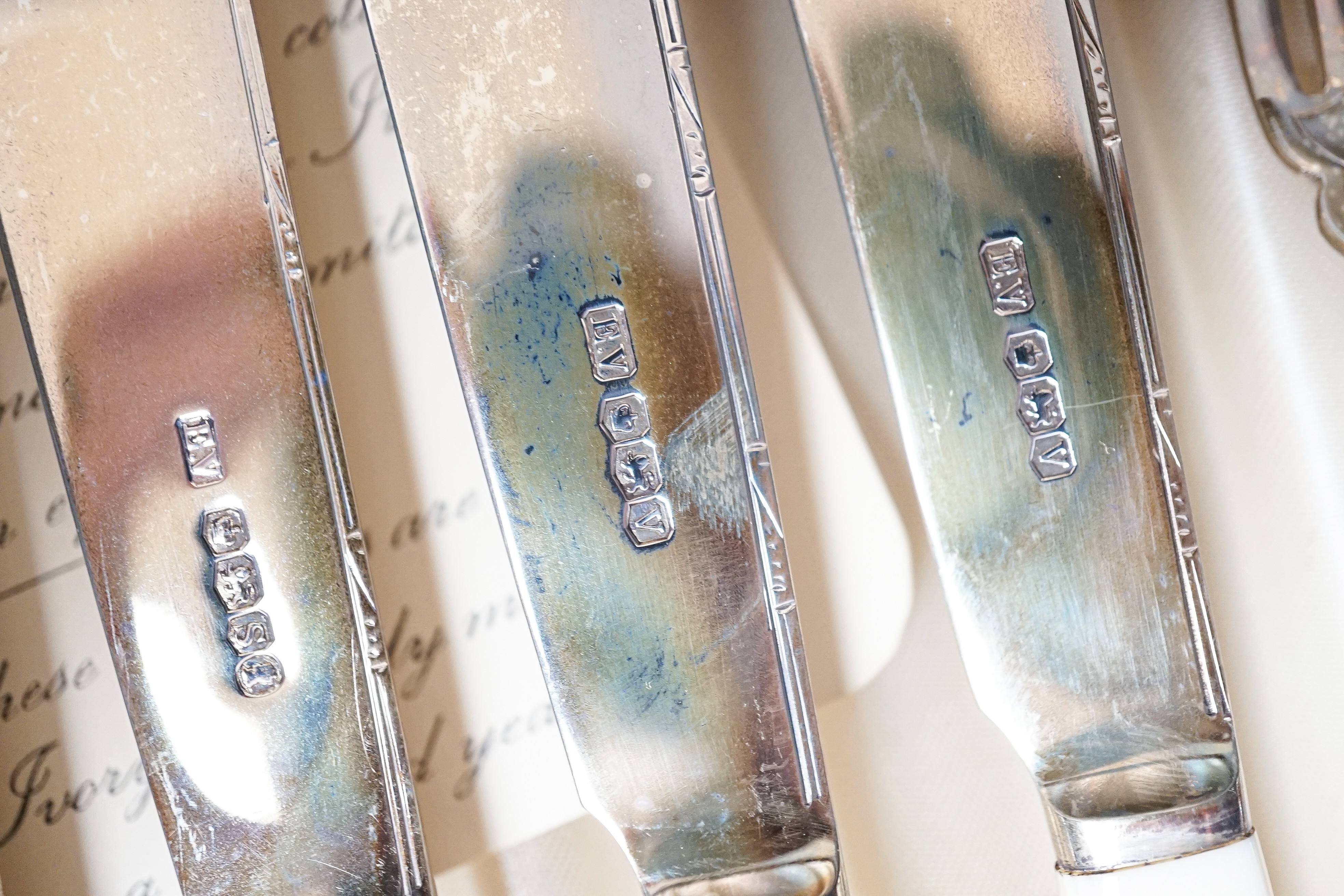 A 1930's cased set of six pairs of ivory handled silver dessert eaters by Viners Ltd, Sheffield, 1936/8/9, gross weight 13.5oz.
